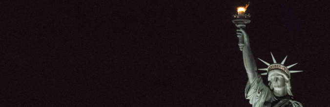 Night view of Liberty's torch and crown