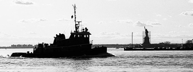 An old photo of a ship in the sea in black and white